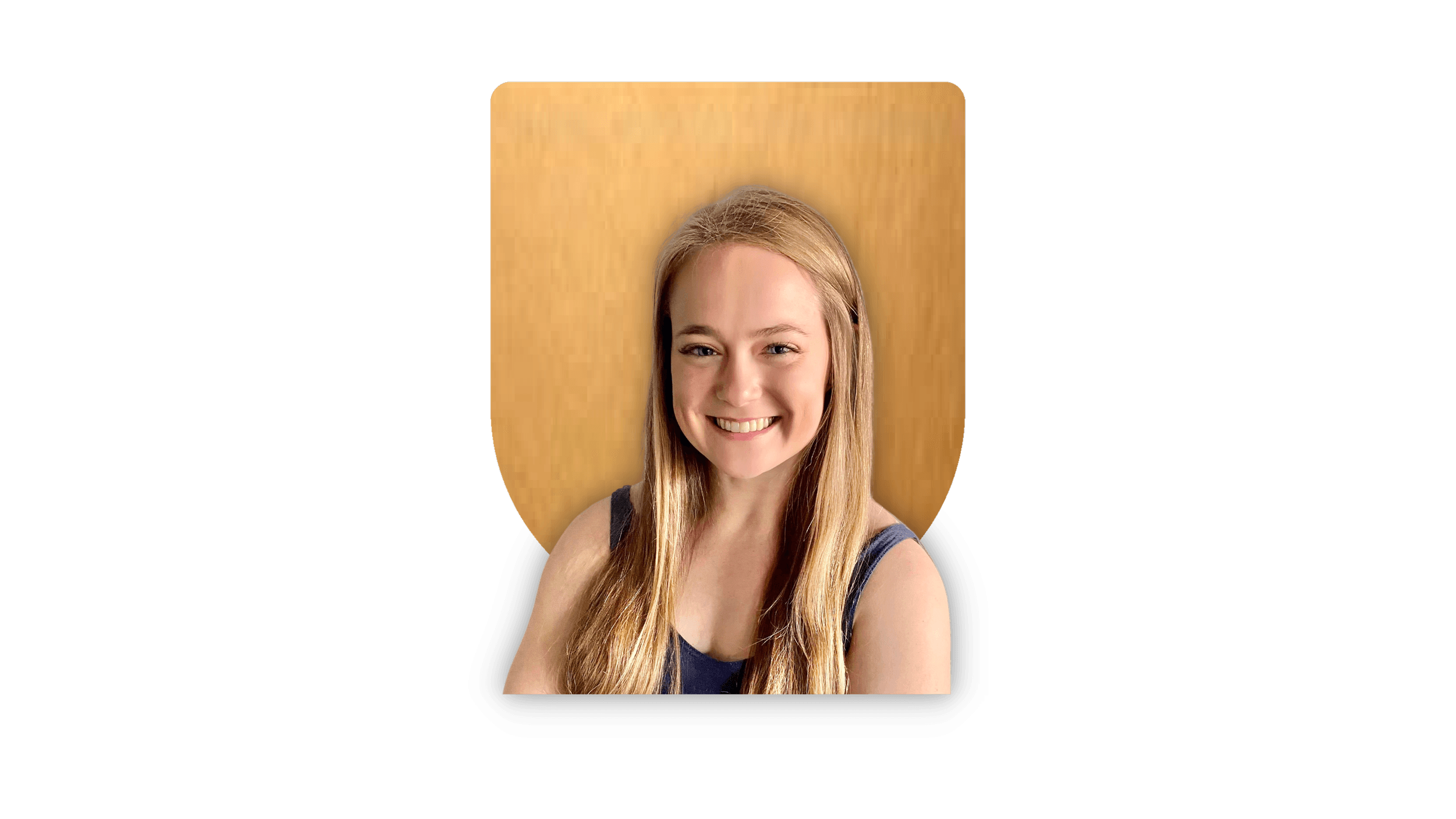 Smiling woman with long blonde hair in front of a wooden background.